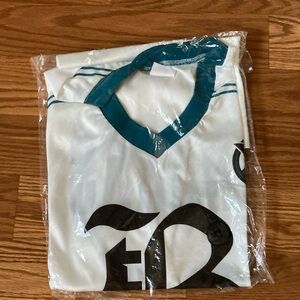White and Teal Soccer jersey from sharks game